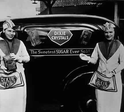 Historical photo of two Dixie Sugar saleswomen